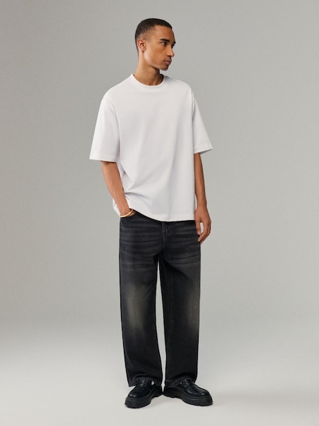 Czarne jeansy baggy loose fit z nadrukiem skrzydeł na tyle