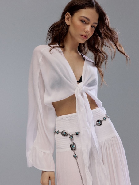 Biżuteryjny pasek z niebieskimi oczkami