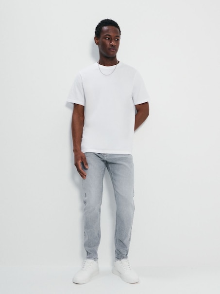 Jasnoszare jeansy carrot fit