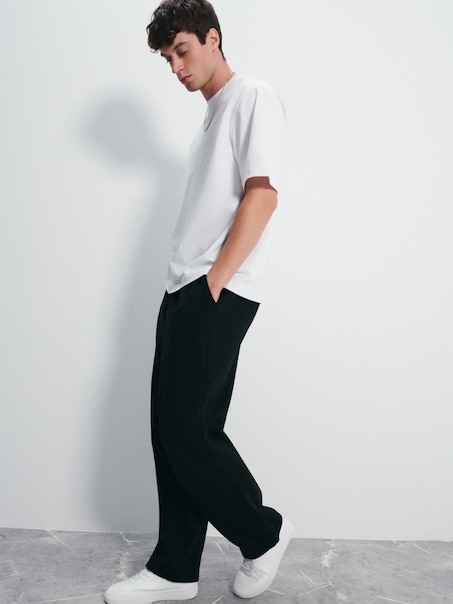 Czarne spodnie dresowe baggy z regulacją na dole