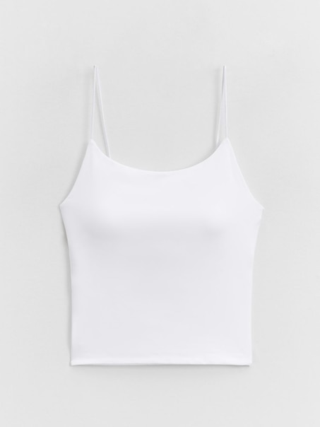 Biały top ULTRAFLEX na cienkich ramiączkach z miseczkami usztwniającymi