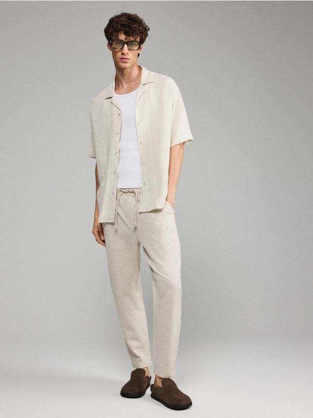 Beżowe spodnie carrot fit z lnem